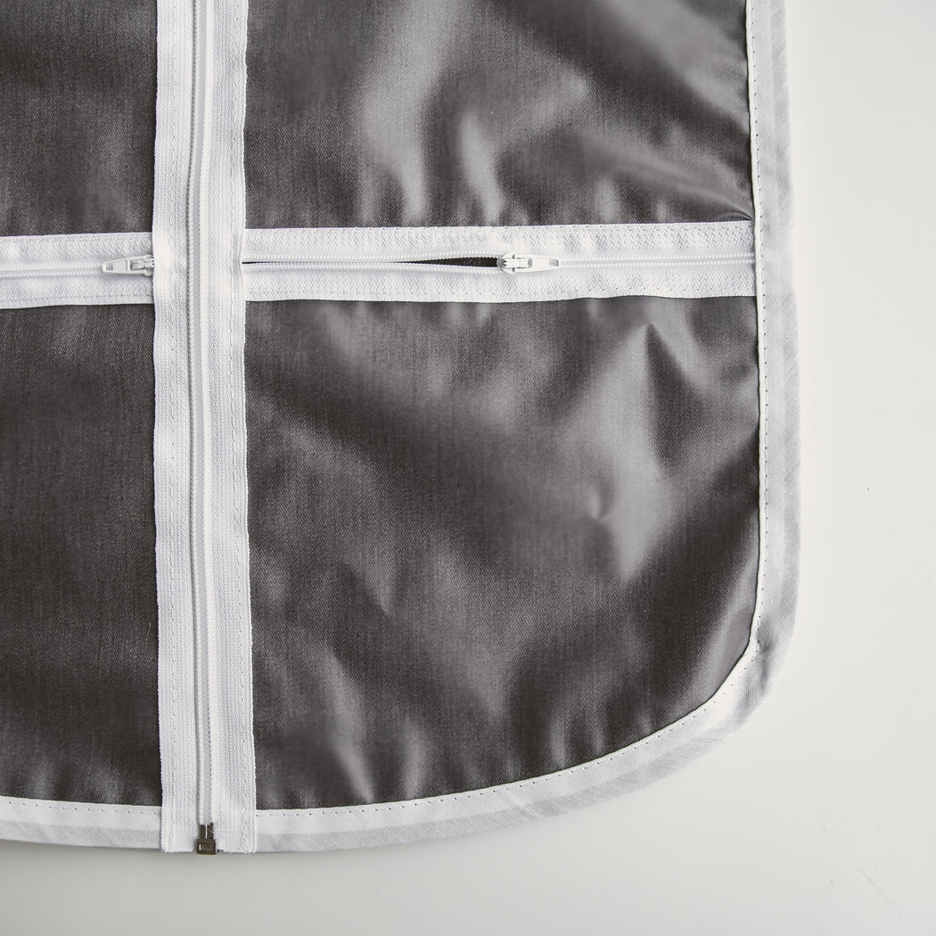 Detail of zippered pockets for accessories not the front of The Hanger Valet - adult size